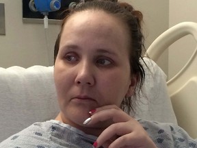 Fliss Cramman is shown in her hospital bed in Dartmouth, N.S., Thursday, Oct.20, 2016. Cramman, a 33-year-old woman facing deportation to the U.K., pleaded Thursday to be allowed to stay in the country she considers home, a day before a hearing that may shed light on her fate. (THE CANADIAN PRESS/Alison Auld)