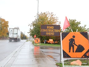 Jason Miller/The Intelligencer
Signs along Adam Street warn drivers of road work up ahead in the industrial park.