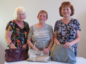Submitted photo: St James Anglican Church members, left to right, Joyce Johnston, Sandra Johnston and Denise Harwood, prepare for the upcoming Pies and Purses fundraiser being held this Saturday. The St. James Anglican Church members are holding a fundraiser for Mom’s Baby Cupboard in Wallaceburg on Saturday Oct. 22 at the U.A.W. Hall on Elm Street. Doors open at 6:30 p.m. and the auction starts at 7 p.m. Mom’s Baby Cupboard provides diapers, wipes, formula, baby food and gently used baby clothing to families in need of these items. They service on average 35 mom’s, and 50 or more babies each month. The “Cupboard” is able to provide these items at no charge thanks to generous donations given by the community. The “Cupboard “which is located at St James Anglican Church is open on the second Thursday of every month from 11 a.m to 1 p.m. The fund raiser auctions off pies and new purses stuffed with surprise “goodies”. There is no admission fee, but for $3 you may enjoy a slice of pie and beverage during the auction.