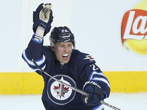 Winnipeg Jets right winger Patrik Laine celebrates his second goal against the Toronto Maple Leafs in the third period during NHL hockey in Winnipeg on Oct. 19, 2016. (Brian Donogh/Winnipeg Sun/Postmedia Network)