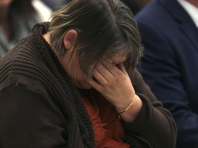 Cheryl Derry, whose husband was killed in a traffic crash, cries after telling her story at a media conference in Winnipeg. Thursday, October 20, 2016.