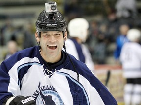 Former Winnipeg Jet Kris King smiles with a camera on his head during the Mike Keane Celebrity Classic in Winnipeg, Man. Thursday Nov. 15, 2012.