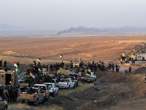 Kurdish peshmerga forces move forward from an assembly point as they prepare to begin an assault to recapture the village of Tiskharab from ISIS on Oct. 20, 2016 near Mosul, Iraq. (Carl Court/Getty Images)