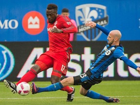TFC's Jozy Altidore dribbles the ball past Montreal defender Laurent Ciman last week. (THE CANADIAN PRESS)