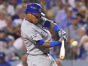 Cubs batter Addison Russell hits a two-run home run off Dodgers pitcher Joe Blanton during the sixth inning of Game 5 of the NL Championship Series in Los Angeles on Thursday, Oct. 20, 2016. (Mark J. Terrill/AP Photo)