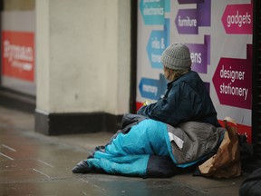 A homeless woman sits near Trafalgar Square on January 27, 2016 in London, England. (Photo by Dan Kitwood/Getty Images)