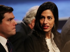Senior Clinton Campaign staffer Huma Abedin and traveling press secretary Nick Merrill (L) are seen after the third U.S. presidential debate at the Thomas & Mack Center on October 19, 2016 in Las Vegas, Nevada. (Photo by Drew Angerer/Getty Images)