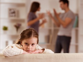 Child suffering from quarrels between parents in the family at home. (Getty Images)