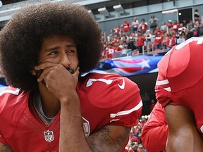 Colin Kaepernick #7 of the San Francisco 49ers kneels on the sideline during the anthem prior to the game against the Dallas Cowboys at Levi's Stadium on October 2, 2016 in Santa Clara, California.