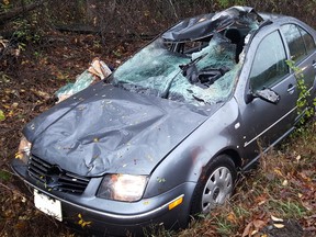 Submitted Photo
The wreckage of a car rests in a ditch after leaving the road and colliding with a tree stump Friday morning in Thurlow. Belleville Police Const. Brad Stitt said the incident should serve as a reminder to motorists to slow down in wet and cold weather.