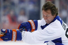 Former Edmonton Oilers hockey player Wayne Gretzky (99) smiles