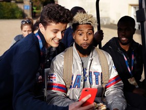 New York Giants wide receiver Odell Beckham Jr. poses for a picture as he sits on a golf buggy before being driven away after a press conference at Syon House in Syon Park, south west London, Friday, Oct. 21, 2016. The Los Angeles Rams are due to play the New York Giants at Twickenham stadium in London on Sunday in a regular season NFL game. (AP Photo/Matt Dunham)