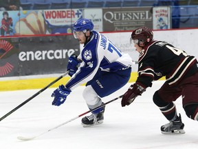 Aiden Jamieson, left, of the Sudbury Wolves, attempts to skate past Matthew Timms, of the Peterborough Petes, during OHL action at the Sudbury Community Arena in Sudbury, Ont. on Friday October 21, 2016. John Lappa/Sudbury Star/Postmedia Network