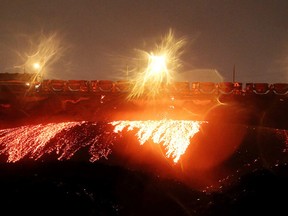 A Vale train dumps slag on Oct. 12. Slag is a byproduct of the smelting process. (Gino Donato/Sudbury Star)