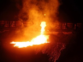 A Vale train dumps slag in Sudbury, Ont. on Wednesday October 12, 2016. Slag is a byproduct of the smelting process. Gino Donato/Sudbury Star/Postmedia Network