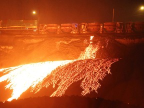 A Vale train dumps slag in Sudbury, Ont. on Wednesday October 12, 2016. Slag is a byproduct of the smelting process. Gino Donato/Sudbury Star/Postmedia Network