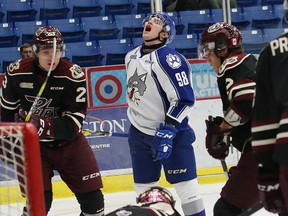 Dmitry Sokolov, middle, of the Sudbury Wolves, reacts after missing a scoring chance against the Peterborough Petes during OHL action at the Sudbury Community Arena in Sudbury, Ont. on Friday October 21, 2016. John Lappa/Sudbury Star/Postmedia Network