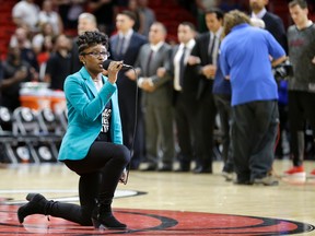 Denasia Lawrence sings the national anthem before an NBA pre-season basketball game between the Miami Heat and the Philadelphia 76ers on Oct. 21, 2016, in Miami. (AP Photo/Alan Diaz)