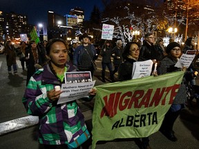 Protesters gather during the Take Back the Night rally at Sir Winston Churchill Square in Edmonton, Alta., on Friday, October 21, 2016. (Codie McLachlan/Postmedia)