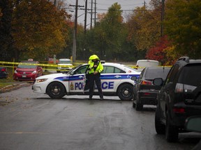 Police investigate after a man was fatally stabbed early Saturday morning on Clyde Avenue, Oct. 22, 2016. Ashley Fraser, Postmedia