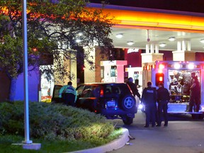 Emergency crews at a gas station near Creditview Rd. and Eglinton Ave. in Mississauga where one man was killed and two others were wounded by gunfire around 4 a.m. on Oct. 22, 2016.(Pascal Marchand/Special to the Toronto Sun)
