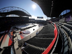 In this photo taken with a fish-eye lens, the Edmonton Oilers practice at Investors Group Field prior to tomorrows game against the Winnipeg Jets in the NHL Heritage Classic in Winnipeg, Saturday, October 22, 2016. (THE CANADIAN PRESS/Trevor Hagan)