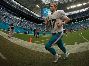 Ryan Tannehill of the Miami Dolphins runs off the field during a game against the Pittsburgh Steelers on October 16, 2016 in Miami Gardens, Florida. (Mike Ehrmann/Getty Images)