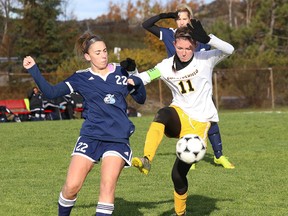 Morgan German, left, of Niagara, and Tiffany Johnson, of Cambrian College, battle for the ball during OCAA soccer action at Cambrian College in Sudbury, Ont. on Saturday October 22, 2016. John Lappa/Sudbury Star/Postmedia Network