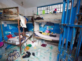 A prison cell is empty after inmates escaped from the Civil Prison in the coastal town of Arcahaiea, Haiti, Saturday, Oct. 22, 2016. Over 100 inmates escaped after they overpowered guards who were escorting them to a bathing area. (AP Photo/Dieu Nalio Chery)