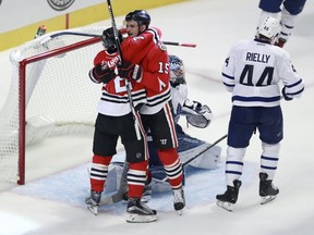 Chicago Blackhawks center Artem Anisimov celebrates his goal with left wing Artemi Panarin during the third period of an NHL hockey game against the Toronto Maple Leafs, Saturday, Oct. 22, 2016, in Chicago. (AP Photo/Jeff Haynes)