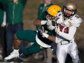 University of Alberta Golden Bears Tylor Henry tackles University of Manitoba Bisons Tanner Hamade at Foote Field on Saturday, October 22, 2016 in Edmonton.
