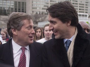 Prime Minister Justin Trudeau (right) is greeted by Toronto Mayor John Tory outside City Hall last January when the prime minister said the federal government would explore the possibility of bidding for Expo 2025 if the city wants to host the spectacle. (THE CANADIAN PRESS)