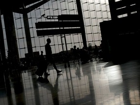 Passengers walk around Malaga's airport in this Sept. 22, 2011 file photo.        (Jorge Guerrero/AFP/Getty Images)