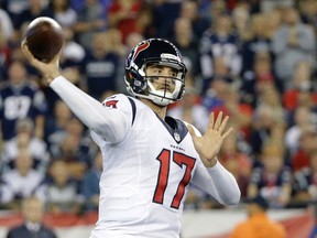 Texans quarterback Brock Osweiler passes against the Patriots during NFL action in Foxborough, Mass., on Sept. 22, 2016. (Elise Amendola/AP Photo)