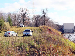 RCMP were still at the scene Oct. 23, along the Red River, near the junction of PRs 204 and 212, where human remains were discovered the day before. Mounties brought in the Manitoba Historical Resources Branch to assist with the investigation. (Glen Hallick, Interlake Publishing, Postmedia Network)