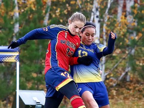 Queen's Golden Gaels Matija Skoko and Laurentian Voyageurs Lucia Valdez battle for the ball during OUA soccer action from Laurentian University in Sudbury, Ont. on Sunday October 23, 2016. Gino Donato/Sudbury Star/Postmedia Network