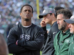 Jets quarterback Geno Smith (left) watches play from the sidelines after leaving the game with a knee injury during the third quarter of an NFL game against the Ravens in East Rutherford, N.J., on Sunday, Oct. 23, 2016. (Bill Kostroun/AP Photo)