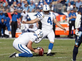 Colts kicker Adam Vinatieri (4) kicks a 33-yard field goal against the Titans during second half NFL action in Nashville, Tenn., on Sunday, Oct. 23, 2016. The kick is the 43rd consecutive field goal for Vinatieri, an NFL record. Holding is Pat McAfee. (James Kenney/AP Photo)