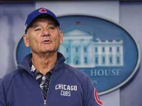 Actor Bill Murray sporting a Chicago Cubs jacket and cap talks during a brief visit in the Brady Press Briefing Room of the White House in Washington, Friday, Oct. 21, 2016. Murray is in Washington to receive the Mark Twain Prize for American Humor. THE CANADIAN PRESS/AP/Manuel Balce Ceneta