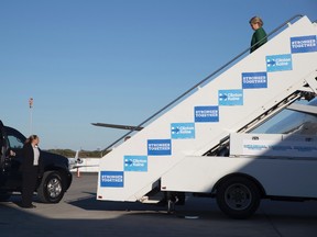 Democratic presidential candidate Hillary Clinton arrives at Charlotte Douglas international airport, Sunday, Oct. 23, 2016, in Charlotte, N.C. (AP Photo/Mary Altaffer)