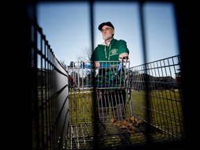 Rick Belsher poses for a photo beside an abandoned shopping cart near his home in north east Edmonton, on Wednesday Oct. 19, 2016. Photo by David Bloom