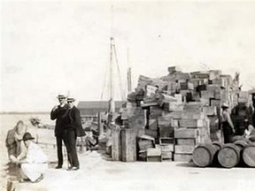 Confiscated prohibition alcohol on a U.S. dock. (Courtesy Radio Canada International)