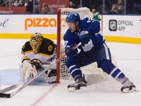 Toronto Maple Leafs' Connor Brown brings the puck around the net in front of Boston Bruins goalie Anton Khudobin during NHL action, in Toronto on Oct. 15, 2016. (THE CANADIAN PRESS/Chris Young)