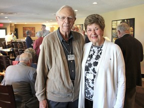 Ron Hardy, left, and Sheena Lucas, with the Probus Club of Kingston-Limestone, stand in the hall where their monthly meeting was about to start in Kingston. The club is mainly for retired professionals or businesspeople, providing a social time. (Michael Lea/The Whig-Standard)