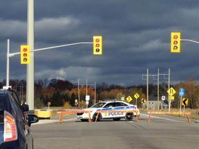 An Ottawa police cruiser blocks off Highway 174 at Trim Road following a fatal crash involving a school bus on Monday, Oct. 24, 2016. JEAN LEVAC / POSTMEDIA