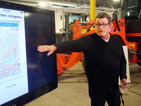 Ken Allen, communications officer for the City of Winnipeg Public Works department, displays the city's new Know Your Zone snow ploughing app during a press conference in Winnipeg, Man. Monday October 24, 2016.