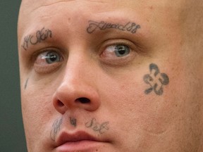 In this July 21, 2016, file photo, Bayzle Morgan appears in his robbery trial at the Regional Justice Center in Las Vegas. Morgan, who was allowed to use makeup to cover his neo-Nazi tattoos during his robbery trial and conviction in August 2016, will not get to hide them during his upcoming murder trial punishable by the death penalty. (Richard Brian/Las Vegas Review-Journal via AP, file)