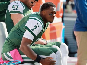 Jets quarterback Geno Smith sits on the sidelines after being taken out of the game due to an injury during NFL action at MetLife Stadium in East Rutherford, N.J., on Sunday. Smith was diagnosed with a torn ACL in his right knee and is out for the rest of the season. (Michael Reaves/Getty Images)