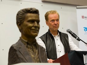 Bill Comrie, shown here at an unveiling following a major donation to MacEwan University Athletics in 2015, became part owner of the Chicago Cubs in 2015. The Cubs are pursuing their first World Series championship since 1908. (Greg Southam)