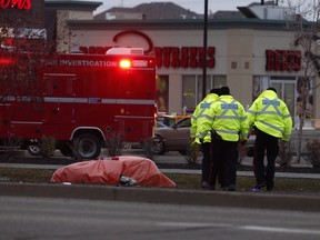 Police investigate a fatal crash near 97 Street and 160 Avenue on Monday Oct. 24, 2016. (Ian Kucerak/Postmedia)